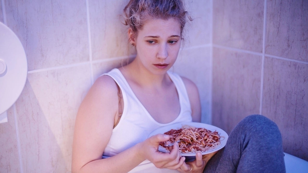 Overeating sad girl